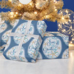 Coastal Beach Christmas SEAS & GREETINGS Wrapping Paper<br><div class="desc">Wrap your Christmas holiday gifts in coastal or beach flair using this roll of wrapping paper featuring a SEAS & GREETINGS elegant calligraphy script typography design accented with starfish in turquoise aqua blue on your choice of background colour (shown with a dark blue colour). ASSISTANCE: For help with design modification...</div>