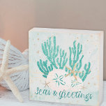 Coastal SEAS & GREETINGS Glitter Coral Starfish Wooden Box Sign<br><div class="desc">Decorate for the Christmas holiday season with this coastal or beach-themed wood box sign featuring gold and turquoise glitter starfish and coral, sand dollars, and a gold glitter SEAS & GREETINGS typography design. ASSISTANCE: For help with design modification or personalisation, colour change, resizing, transferring the design to another product or...</div>