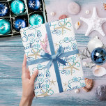 Coastal Tropical Christmas SEAsons Greetings Wrapping Paper<br><div class="desc">Wrap your Christmas holiday gifts in a tropical, coastal flair featuring SEAS & GREETINGS in an elegant calligraphy script typography design accented with starfish in turquoise aqua blue colours on an editable white background. ASSISTANCE: Contact the designer via Zazzle Chat or makeitaboutyoustore@gmail.com if you'd like this design modified or on...</div>