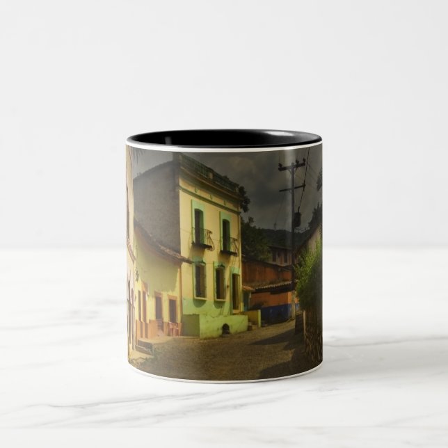 Cobblestone Road & Yellow Buildings in Mexico Two-Tone Coffee Mug (Center)