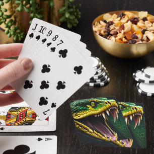 Cobra snake with vibrant green and yellow scales playing cards