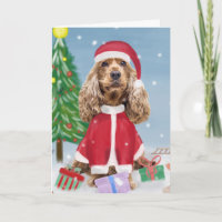Cocker Spaniel Dog in Snow with Christmas Gifts
