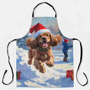 Cocker Spaniel Running in Snow with Christmas Hat Apron