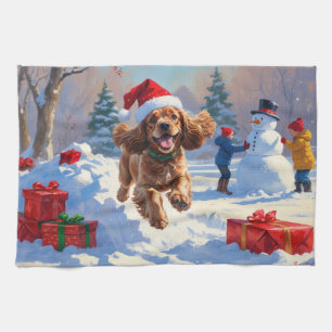 Cocker Spaniel Running in Snow with Christmas Hat Tea Towel