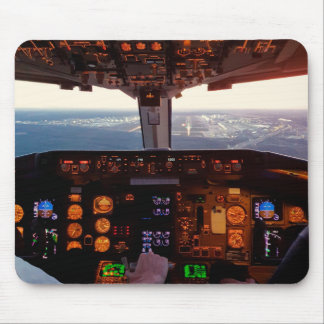 Cockpit view of commercial jet aeroplane landing o mouse mat