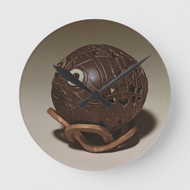 Coconut sculpted into a face, c.1895 round clock (Front)