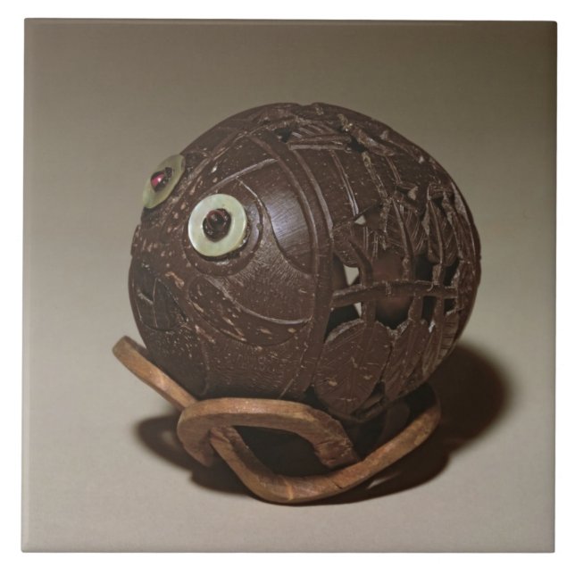 Coconut sculpted into a face, c.1895 tile (Front)