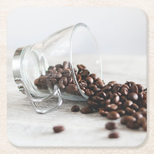 Coffee Beans Spilling out of a Clear Coffee Cup Square Paper Coaster