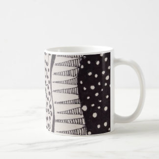 Coffee mug with black and white drawing
