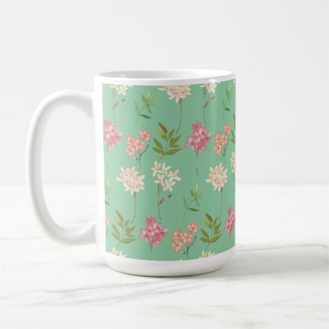 coffee mug with floral design on green background (Left)