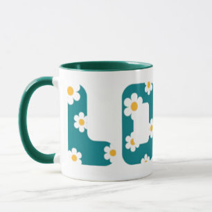 coffee mug with love phrase covered with flowers