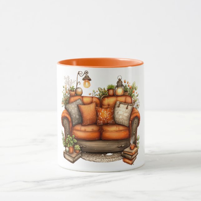 Coffee mug with warm tones of couch and flowers (Center)