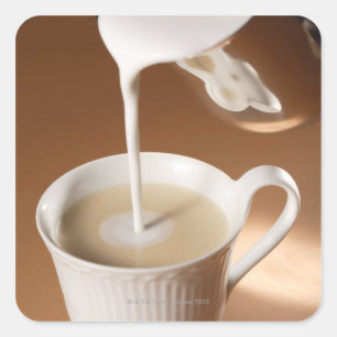 Coffee with milk being poured in square sticker