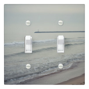 Cold calm sea on a winter day light switch cover