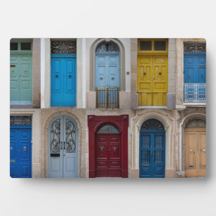 Collage of colourful front doors plaque