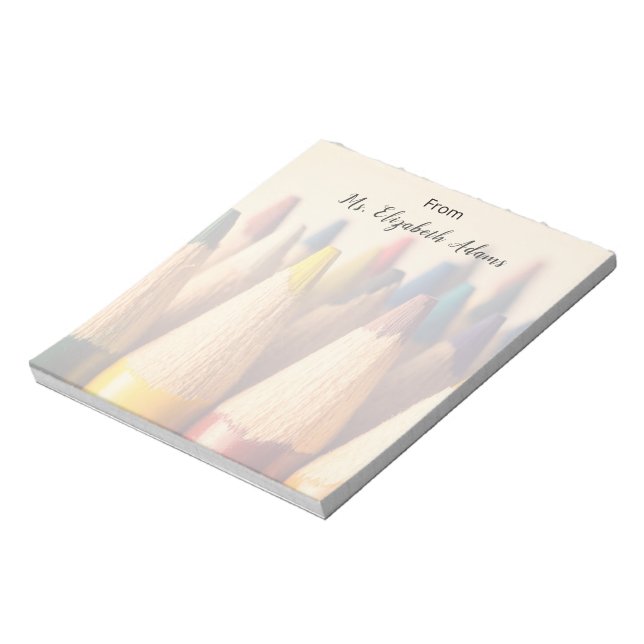 Colored pencils background. notepad (Rotated)