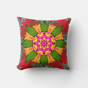 Colored round floral mandala on a red, green and cushion