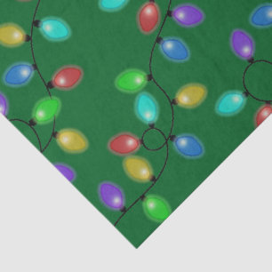 Colorful Christmas Lights On Green Tissue Paper