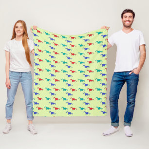 Colorful dino on green fleece blanket