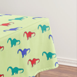 Colorful dino on green tablecloth