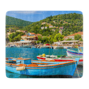 Colorful Greek fishing boats in port of Kioni Cutting Board