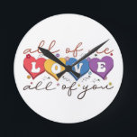 Colorful Heart Love Quote Round Clock<br><div class="desc">Express deep love and connection with this beautiful “All of Me Loves All of You” design. Featuring vibrant heart-shaped letters, soft floral accents, and elegant handwritten typography on a dark background, this artwork is perfect for couples, anniversaries, Valentine’s Day, weddings, or romantic gifts. Its warm, heartfelt message makes it ideal...</div>
