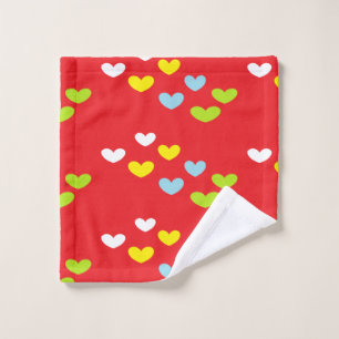 Colorful hearts on red wash cloth