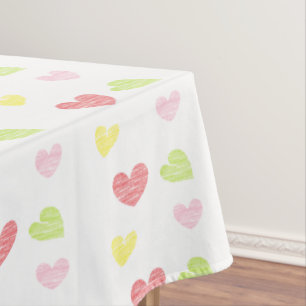 Colorful hearts on white tablecloth