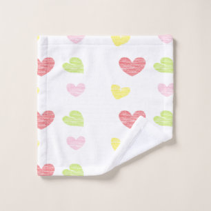 Colorful hearts on white wash cloth