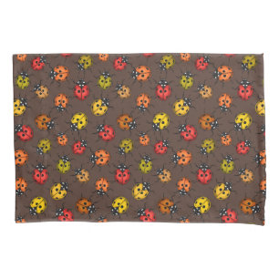 Colorful ladybugs on brown pillowcase