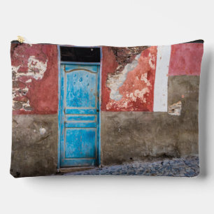 Colorful wall with blue door accessory pouch