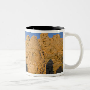 Colossal head statues of Gods guarding the 2 Two-Tone Coffee Mug
