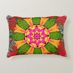 Coloured round floral mandala on a red, green and decorative cushion