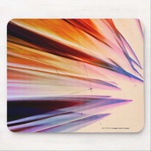Colourful abstract objects against white mouse mat