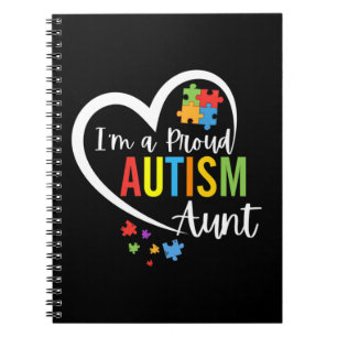 Colourful autism awareness puzzle pieces heart per notebook