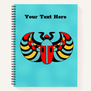 Colourful Bright Egyptian Scarab Beetle on Aqua Notebook