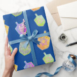 Colourful Bright Spinning Star Dreidels Hanukkah  Wrapping Paper<br><div class="desc">A modern and colourful Hanukkah gift wrapping paper featuring colourful bright star of David twirling dreidels on a solid rich deep blue background.</div>