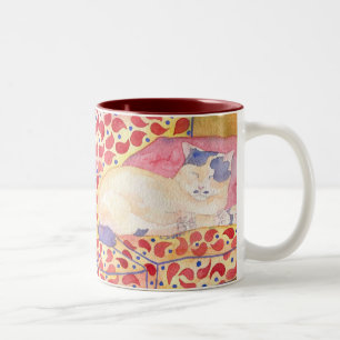 Colourful cat on sofa mug