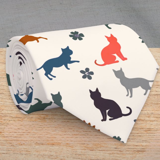Colourful Cat Silhouettes Feline Pattern Elegant Tie (A cream tie with cat silhouettes in black, gray, blue, green and coral, with flower and leaf detail)