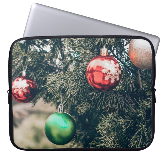 Colourful Christmas bauble decoration on a tree. V Laptop Sleeve (Front)