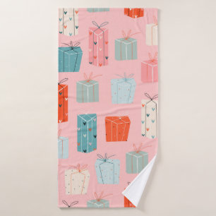 Colourful Christmas gifts on a pink background. Se Bath Towel