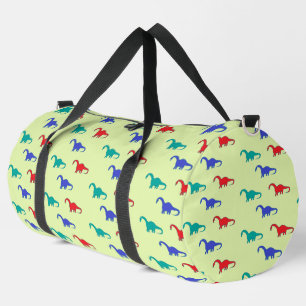 Colourful dinosaurs pattern on green duffle bag