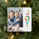 Colourful Festive JOY Christmas Photo Ceramic Ornament<br><div class="desc">Add a touch of colour to your Christmas tree with this fun, bright holiday photo ornament, featuring colourful typography reading, "JOY." The word JOY is designed with an overlapping tissue paper look in bold colours of green, lime, pink, red, aqua blue, and golden yellow. *Artwork created exclusively by Orabella Prints....</div>