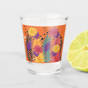 colourful flowers and leaves on a black background shot glass