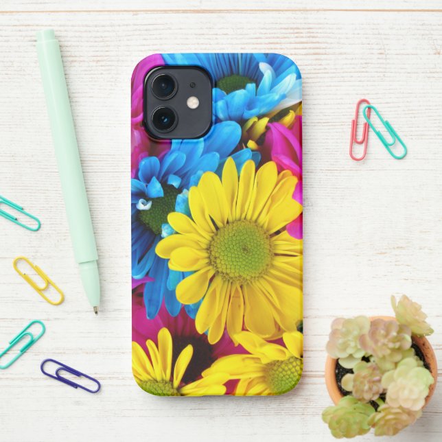 Colourful Flowers, Daisies - Blue Yellow Pink iPhone Case (On Desk)