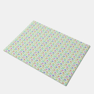 Colourful flowers on pale green doormat