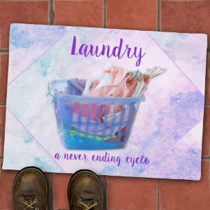 Colourful Folded Laundry On Hangers In Blue Basket Doormat