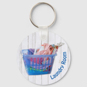Colourful Folded Laundry On Hangers In Blue Basket Key Ring
