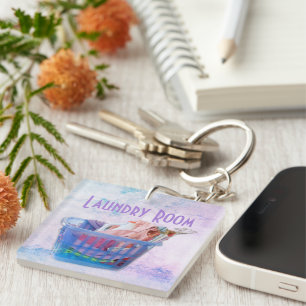 Colourful Folded Laundry On Hangers In Blue Basket Key Ring