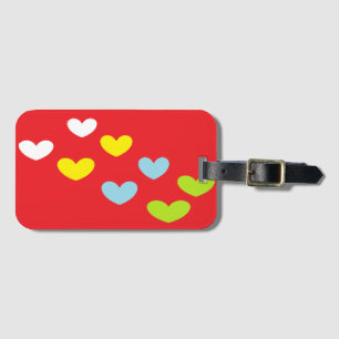 Colourful hearts on red luggage tag